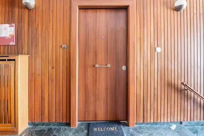 a wooden door on the side of a building at Athenian Entertainment & Relaxation Hub in Athens