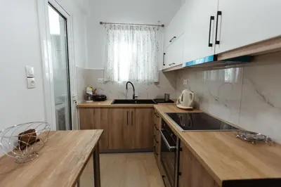 a kitchen with a sink and a counter top at Amaltheia athens in Athens