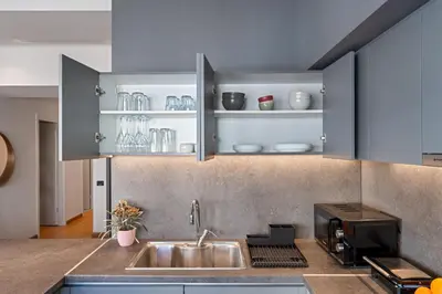 a kitchen with a sink and a microwave at Ofi the Fourth - 2-BR, Exarcheia in Athens