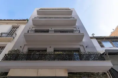 an external view of a building with balconies at Ofi the Fourth - 2-BR, Exarcheia in Athens