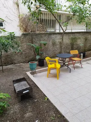 a patio with chairs and a table and a table and chairs at Golden Hotel in Athens