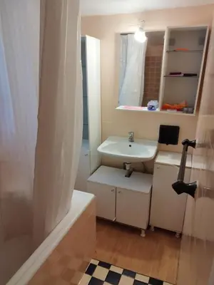 a bathroom with a sink and a mirror at Golden Hotel in Athens