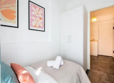 a room with a bed with two towels on it at Urban Haven in Pagrati by MK in Athens