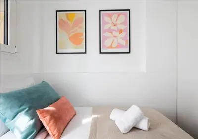 a room with three framed pictures on the wall at Urban Haven in Pagrati by MK in Athens