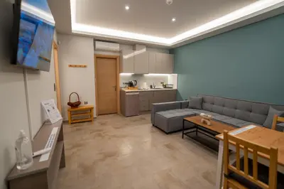 a living room with a couch and a table at Happy apartments 0 in Athens