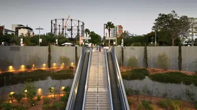 a walkway in a park with a roller coaster at Happy apartments 0 in Athens