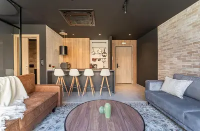 a living room with a couch and a table at Acropolis Industrial Loft in Athens