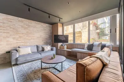 a living room with a couch and a table at Acropolis Industrial Loft in Athens