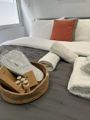 a bedroom with a bed with a basket on it at Central Stay in Athens in Athens
