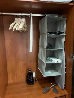 a room with a closet with shelves and utensils at Central Stay in Athens in Athens