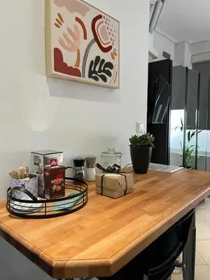 a wooden table with items on it in a kitchen at Central Stay in Athens in Athens