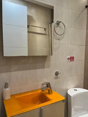 a bathroom with a sink and a mirror and a toilet at Central Stay in Athens in Athens