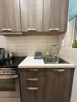 a kitchen with a sink and a stove at Central Stay in Athens in Athens