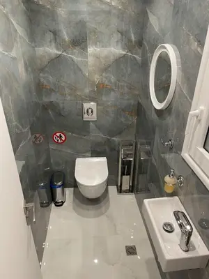 a bathroom with a toilet and a sink at Bubble & Relax- Private Jacuzzi Near Acropolis- Fix Metro 180m in Athens