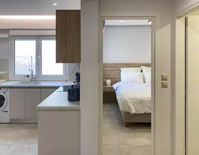 a kitchen and a bedroom with a bed and a sink at Stylish Apartment in the Heart of Athens in Athens
