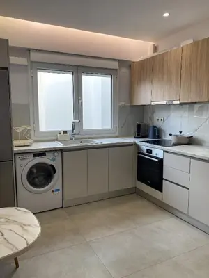 a kitchen with a sink and a washing machine at Stylish Apartment in the Heart of Athens in Athens