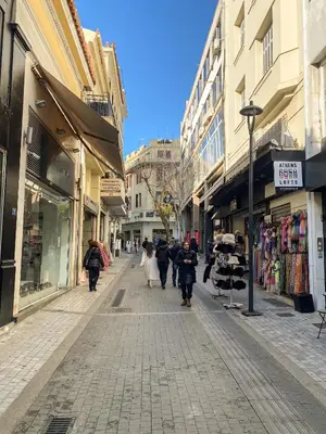 a group of people walking down a street at Stylish Apartment in the Heart of Athens in Athens