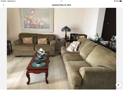 a living room with a couch and a coffee table at Sunshine place in Glyfada in Athens