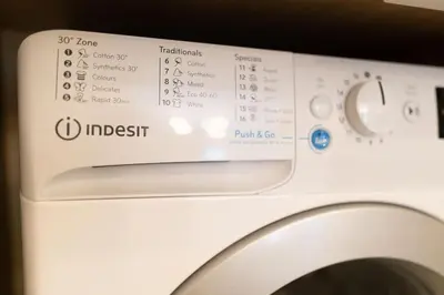 a close up of a washing machine with the settings at Athens, a modern apartment in the historic center in Athens