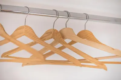 a bunch of wooden utensils hanging from a rack at apartment10minutesfrommonastiraki in Athens