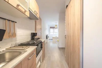 a kitchen with a sink and a stove at studio 10min from Monastiraki Athens in Athens