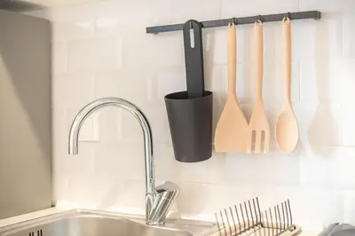 a kitchen counter with a sink and a kitchen utensils at studio 10min from Monastiraki Athens in Athens