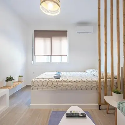 a bedroom with a bed and a window at studio 10min from Monastiraki Athens in Athens