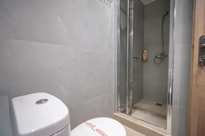a bathroom with a toilet and a shower at City Center Studio for 2 by MPS in Athens