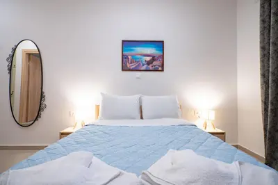 a bedroom with a bed and a mirror at City Center Studio for 2 by MPS in Athens