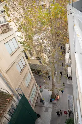 an overhead view of a street between two buildings at Comfy Studio with private terrace by MPS in Athens