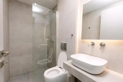 a bathroom with a toilet and a sink and a shower at 11 Reasons Why Metaxourgeio in Athens