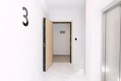 a hallway with a door leading into a room at 11 Reasons Why Metaxourgeio in Athens