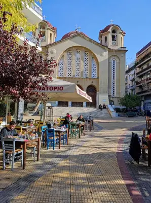 a group of tables and chairs in front of a building at ARIS- The Urban Retreat in Athens