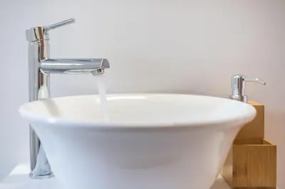 a white sink with a faucet and water at studio3 - -10-minutes-from-Monastiraki-Athens! in Athens