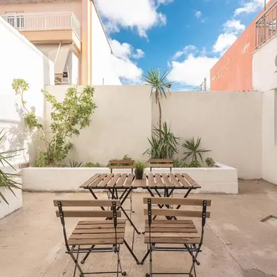 a patio with a table and two chairs at studio3 - -10-minutes-from-Monastiraki-Athens! in Athens