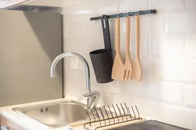 a kitchen counter with a sink and a kitchen utensils at studio3 - -10-minutes-from-Monastiraki-Athens! in Athens