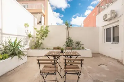 a patio with three chairs and a table and a fence at studio3 - -10-minutes-from-Monastiraki-Athens! in Athens