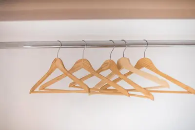a bunch of wooden hangers hanging from a rail at studio3 - -10-minutes-from-Monastiraki-Athens! in Athens
