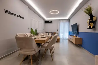 a dining room with a table and chairs at Dione Elegant Apartment Near Acropolis in Athens