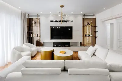 a living room with a white couch and a tv at 4bd Ensuite Luxury Residence Kolonaki in Athens