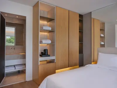 a bedroom with a bed and a bathroom at Nur Riviera Aparthotel in Athens