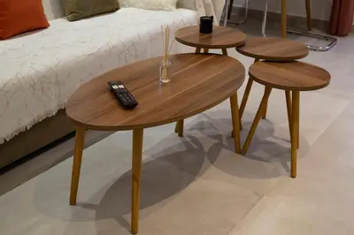 two tables with a remote control and two stools at Acropolis Sneak peak 5th floor in Athens