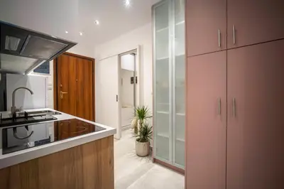 a kitchen with a sink and a counter top at Acropolis Sneak peak 5th floor in Athens