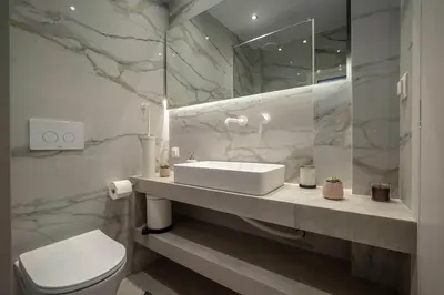 a bathroom with a sink and a toilet at Acropolis Sneak peak 5th floor in Athens