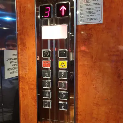 an elevator button with the number eight on it at Sagma Athens House Metro Panormou in Athens