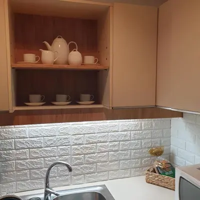 a kitchen with a sink and a shelf with dishes at Sagma Athens House Metro Panormou in Athens