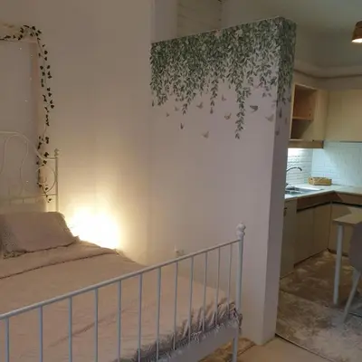 a small bedroom with a bed and a kitchen at Sagma Athens House Metro Panormou in Athens