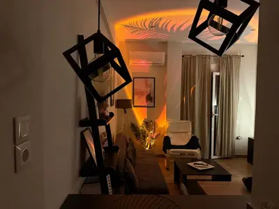 a living room with a couch and a table at 22st Phoenix in Athens