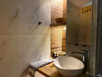 a bathroom with a white toilet and a sink at 22st Phoenix in Athens