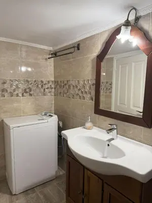 a bathroom with a sink and a mirror at Neoclassical Royal Palace next to Acropolis in Athens